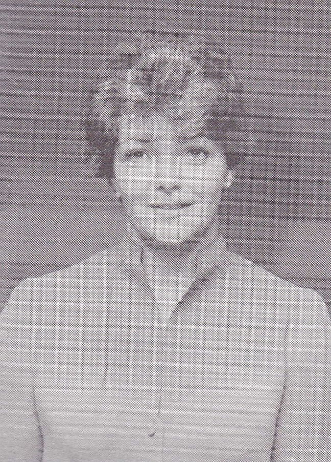 Portrait of a woman in vintage style, professional attire, monochrome image.